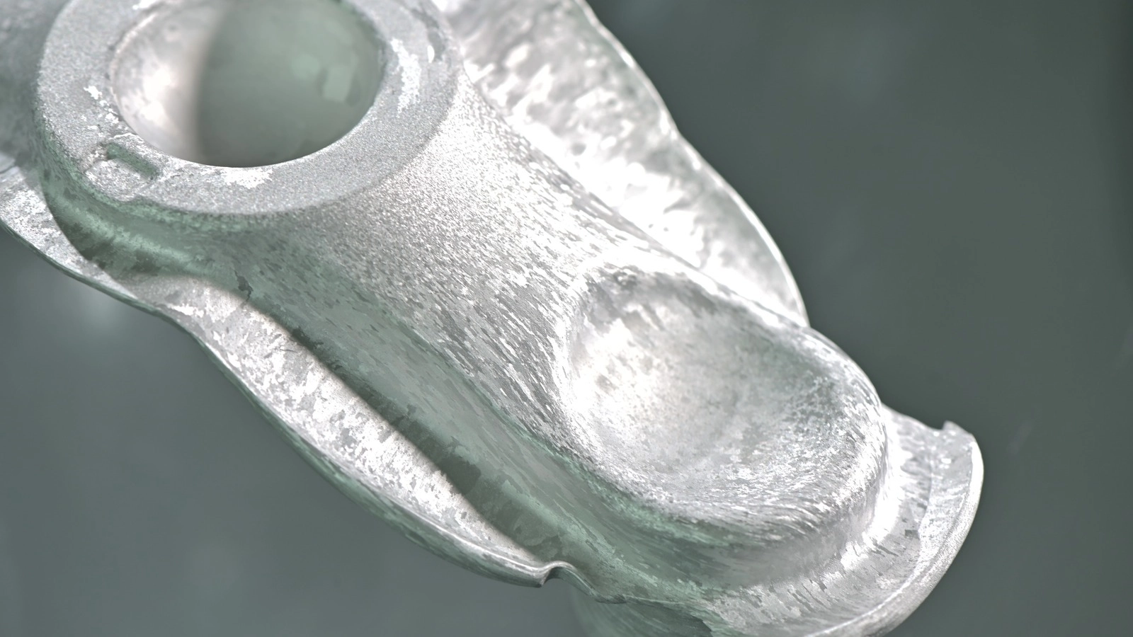 As-forged aluminum surface showing grain texture from metal flow